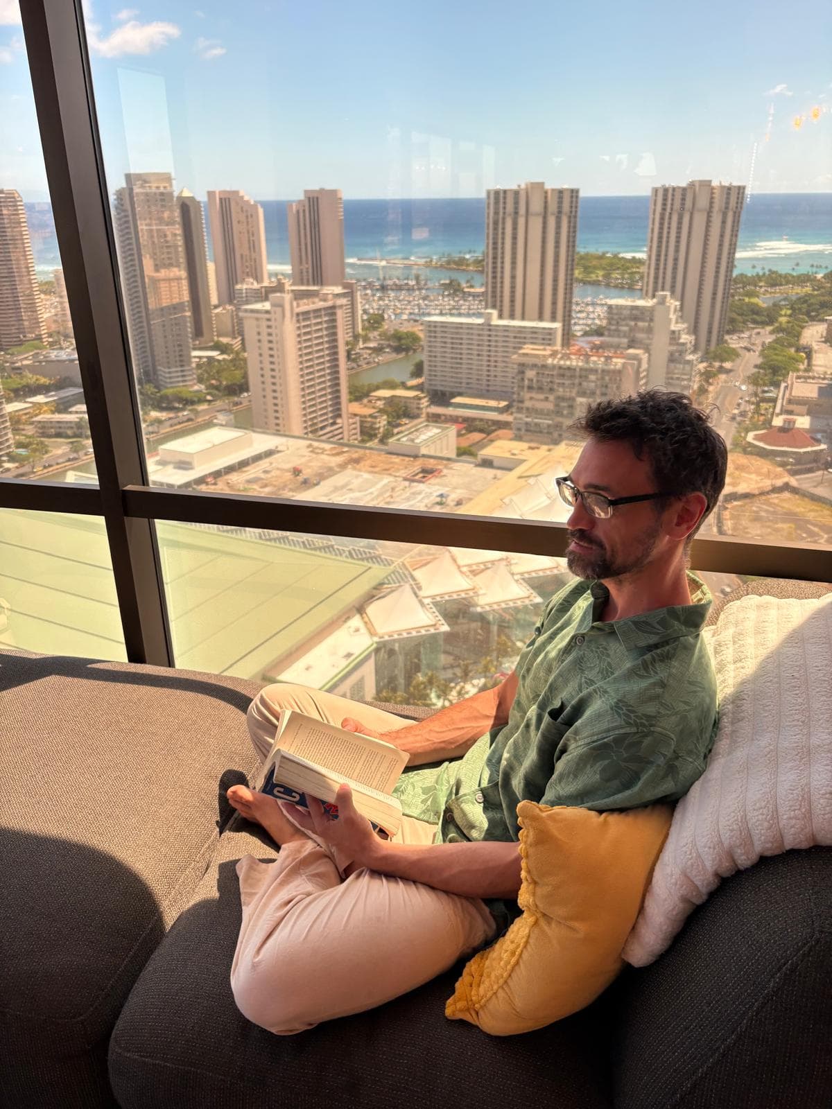 Jason Gentrup reading at home in Honolulu
